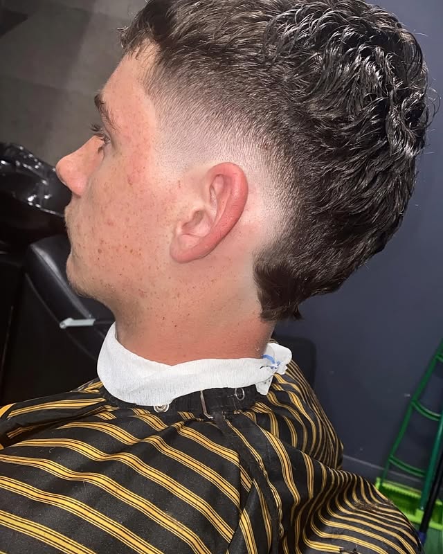 Curly top with clean burst fade