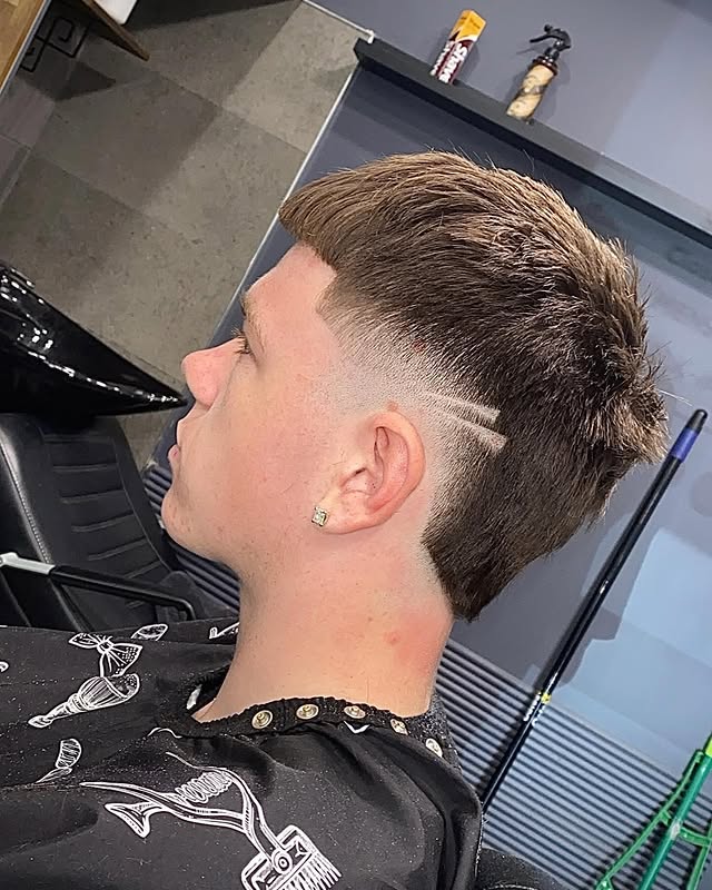 Sharp skin fade with line-up finished at Barberz Den